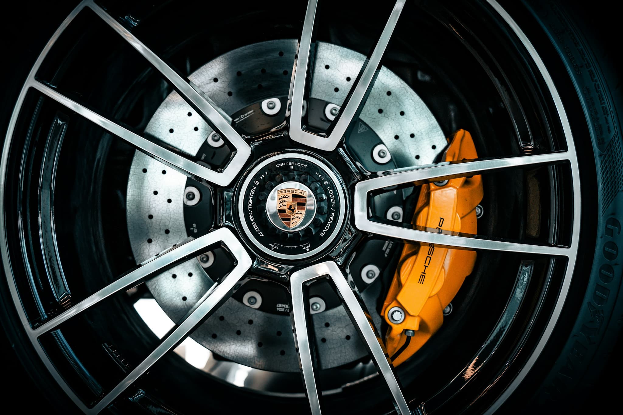 A close view of an alloy wheel and brake caliper